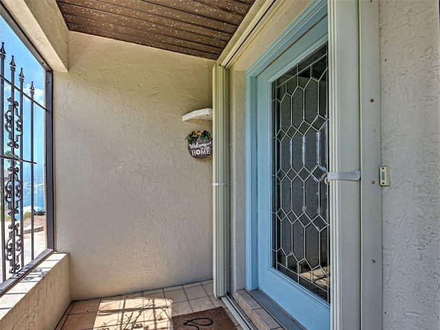 5832 Monroe Rd, Venice, FL 34293 - entrance to property with stucco siding and a balcony