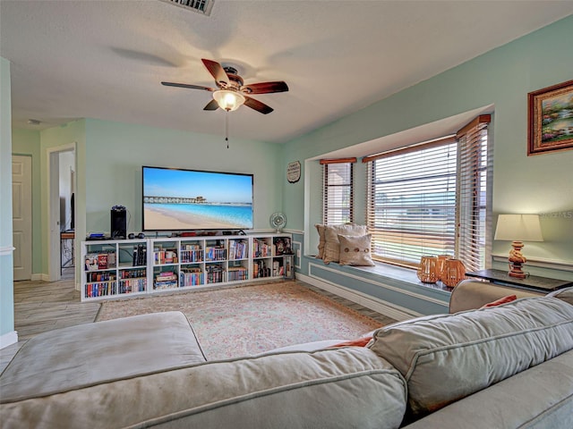 5832 Monroe Rd, Venice, FL 34293 - living area with ceiling fan and baseboards