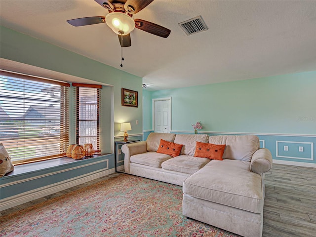 5832 Monroe Rd, Venice, FL 34293 - living area featuring baseboards, wood finished floors, a ceiling fan, and a textured ceiling