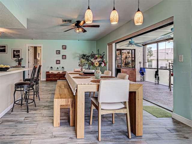 5832 Monroe Rd, Venice, FL 34293 - dining room featuring ceiling fan, light wood-style flooring, and baseboards