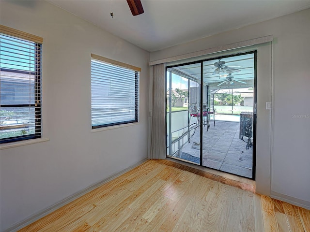 5832 Monroe Rd, Venice, FL 34293 - unfurnished room featuring a ceiling fan, wood finished floors, and healthy amount of natural light