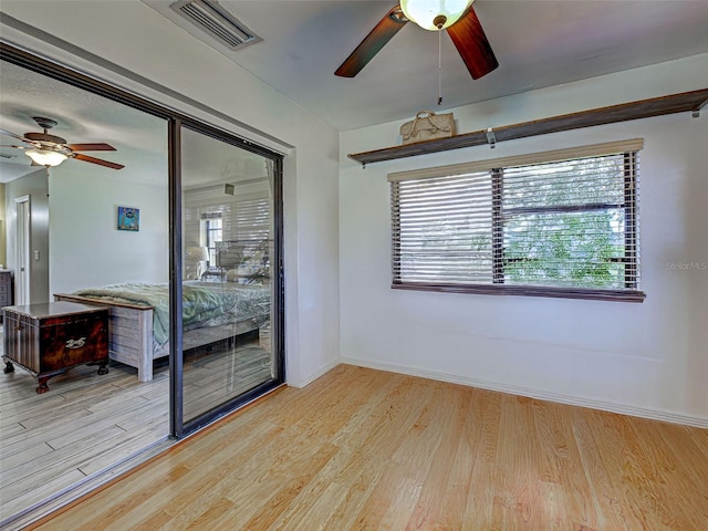 5832 Monroe Rd, Venice, FL 34293 - unfurnished room with a ceiling fan, light wood finished floors, and baseboards
