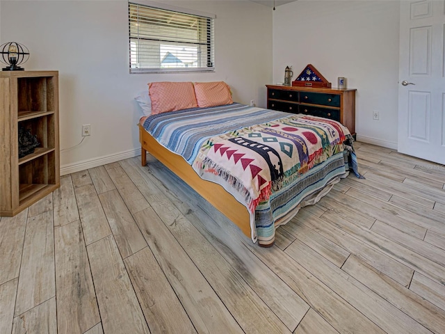 5832 Monroe Rd, Venice, FL 34293 - bedroom with wood finished floors and baseboards