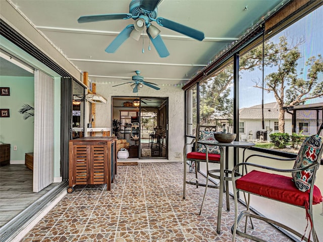 5832 Monroe Rd, Venice, FL 34293 - sunroom / solarium featuring a ceiling fan