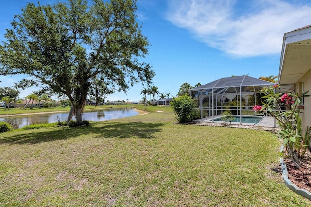 25509 Arequipa Dr, Punta Gorda, FL 33983 - view of green lawn featuring a water view, an outdoor pool, and a lanai
