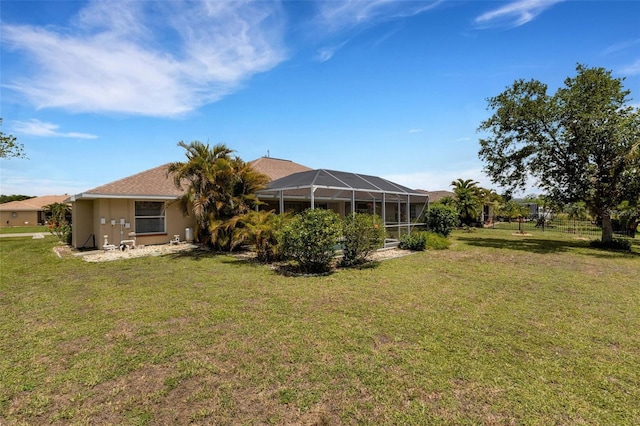 25509 Arequipa Dr, Punta Gorda, FL 33983 - back of house with glass enclosure and stucco siding