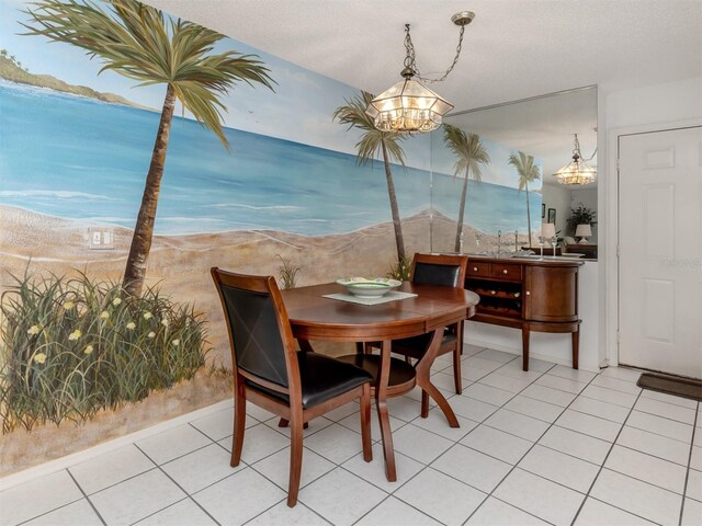 528 W Venice Ave Unit 1, Venice, FL 34285 - dining room featuring a chandelier, light tile patterned flooring, and a water view