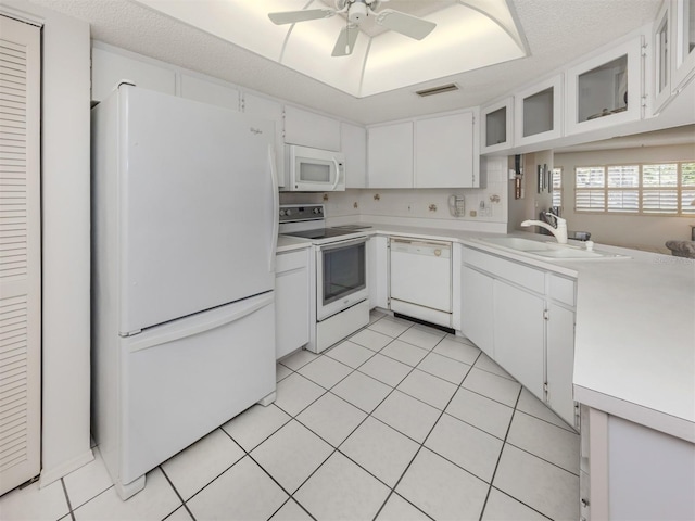 528 W Venice Ave Unit 1, Venice, FL 34285 - kitchen featuring white appliances, light countertops, a ceiling fan, a sink, and light tile patterned floors