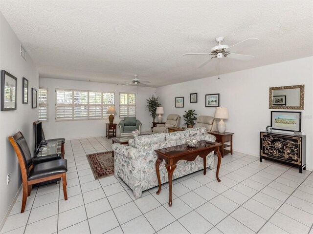 528 W Venice Ave Unit 1, Venice, FL 34285 - living area featuring ceiling fan, a textured ceiling, and light tile patterned floors