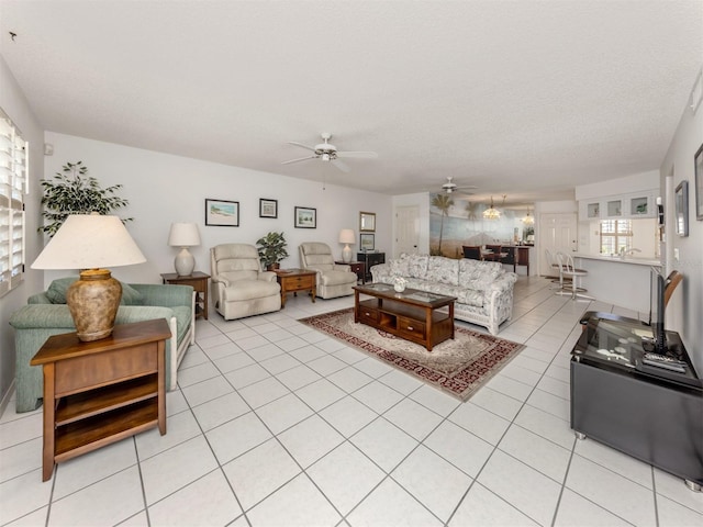 528 W Venice Ave Unit 1, Venice, FL 34285 - living area featuring ceiling fan, light tile patterned flooring, and a textured ceiling
