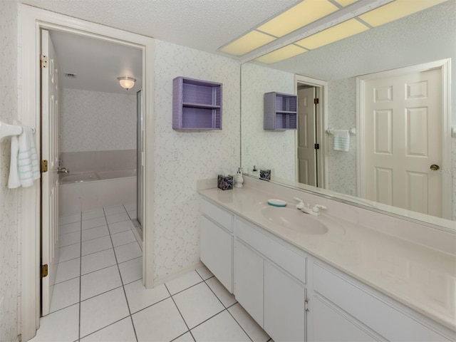 528 W Venice Ave Unit 1, Venice, FL 34285 - full bath with tile patterned floors, vanity, a textured ceiling, a bath, and wallpapered walls