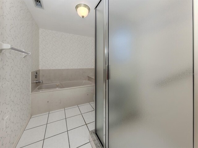 528 W Venice Ave Unit 1, Venice, FL 34285 - bathroom with a garden tub, a stall shower, and tile patterned floors