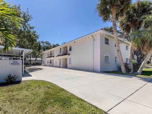 528 W Venice Ave Unit 1, Venice, FL 34285 - rear view of property featuring a patio area, stucco siding, and a yard