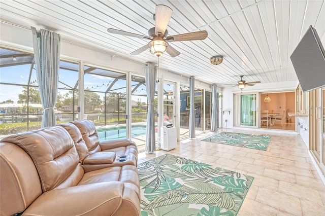 sunroom with a ceiling fan