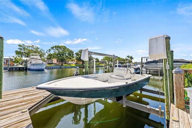 dock featuring a water view and boat lift