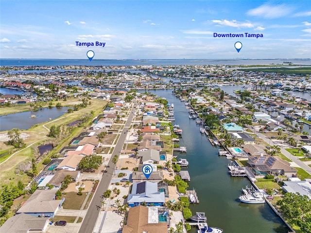 aerial view of residential area with a nearby body of water