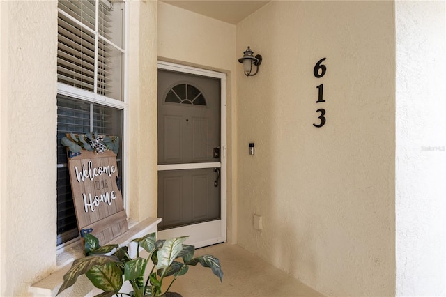 600 Gardens Edge Dr Unit 613, Venice, FL 34285 - property entrance featuring stucco siding