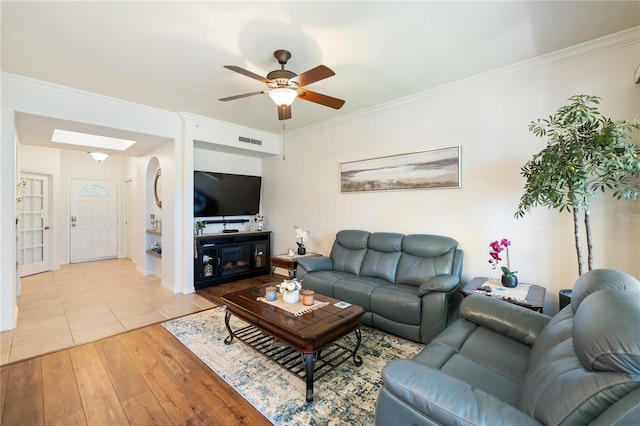 600 Gardens Edge Dr Unit 613, Venice, FL 34285 - living room featuring light wood-style floors, crown molding, a ceiling fan, and baseboards