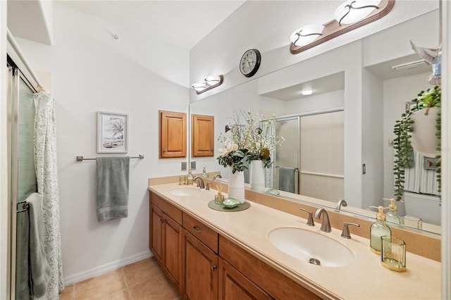 600 Gardens Edge Dr Unit 613, Venice, FL 34285 - full bath with a shower stall, double vanity, tile patterned flooring, and baseboards