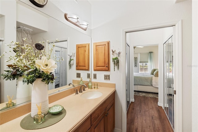 600 Gardens Edge Dr Unit 613, Venice, FL 34285 - bathroom featuring wood finished floors, vanity, and ensuite bath