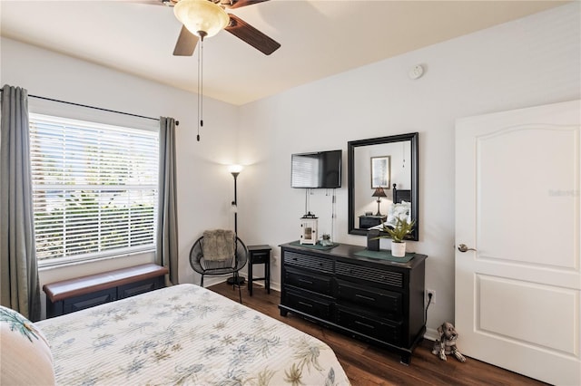 600 Gardens Edge Dr Unit 613, Venice, FL 34285 - bedroom with multiple windows, dark wood-type flooring, a ceiling fan, and baseboards