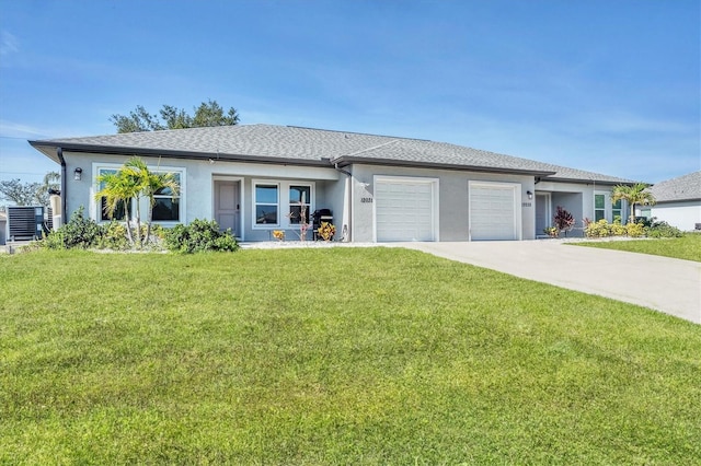 12031 Saragossa Ln, North Port, FL 34287 - view of front facade featuring stucco siding, a garage, a front lawn, and concrete driveway