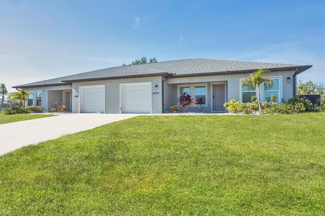 12031 Saragossa Ln, North Port, FL 34287 - ranch-style house featuring stucco siding, a garage, a front yard, and concrete driveway