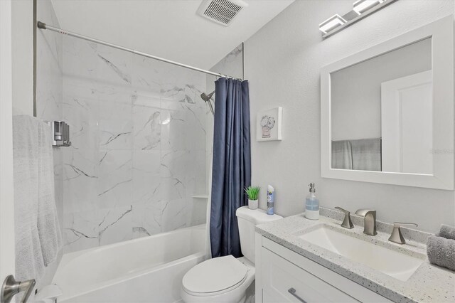 12031 Saragossa Ln, North Port, FL 34287 - full bathroom featuring shower / bath combination with curtain, toilet, and vanity