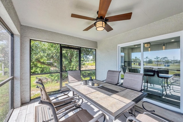 12031 Saragossa Ln, North Port, FL 34287 - sunroom with outdoor dining space, ceiling fan, and healthy amount of natural light