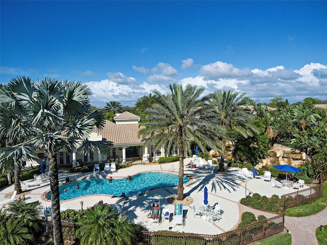 212 Triano Cir Unit 212, Venice, FL 34292 - community pool with fence and a patio area