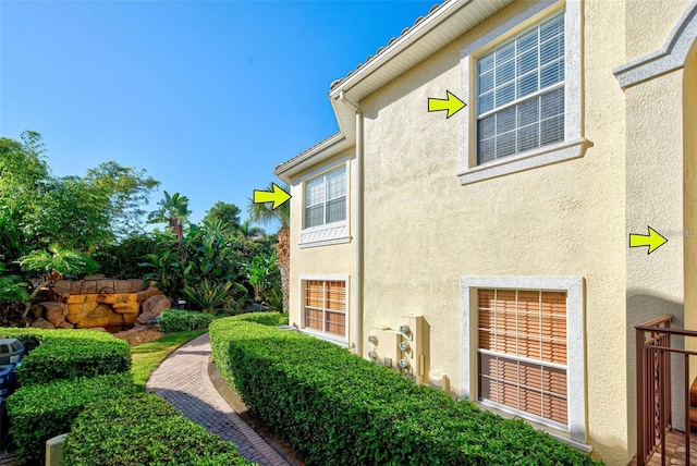 212 Triano Cir Unit 212, Venice, FL 34292 - view of property exterior featuring stucco siding