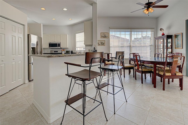 212 Triano Cir Unit 212, Venice, FL 34292 - dining room featuring plenty of natural light, ceiling fan, light tile patterned flooring, and recessed lighting
