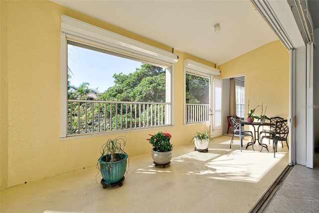 212 Triano Cir Unit 212, Venice, FL 34292 - sunroom / solarium with a textured wall, plenty of natural light, and lofted ceiling
