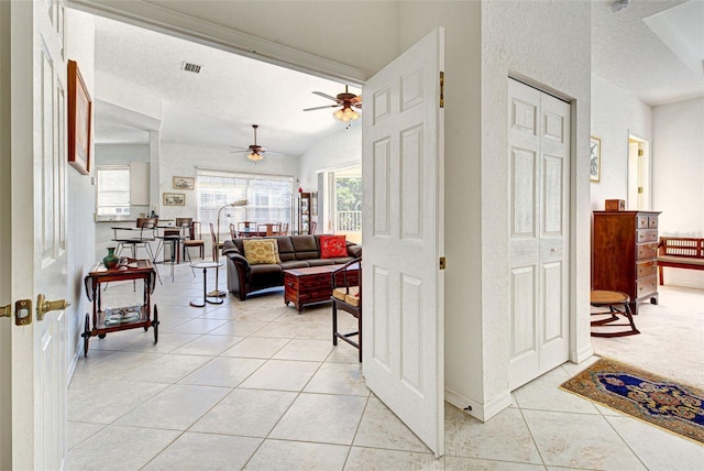 212 Triano Cir Unit 212, Venice, FL 34292 - hallway with light tile patterned floors and baseboards
