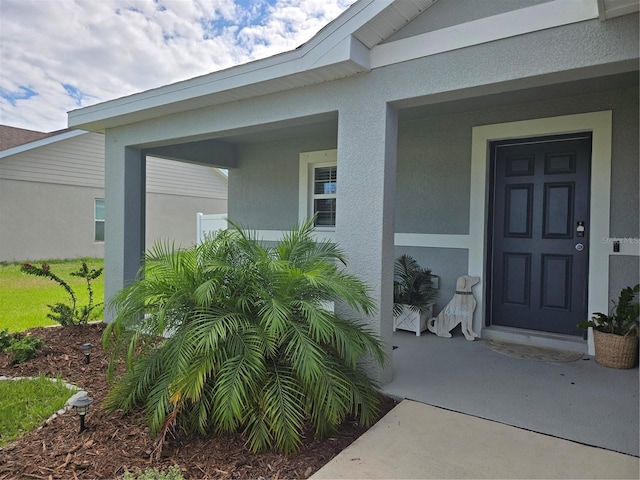 3003 58th Way E, Palmetto, FL 34221 - property entrance with stucco siding and covered porch