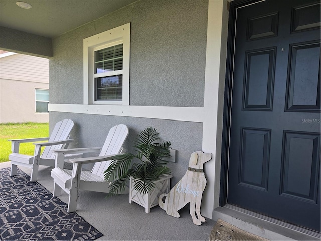 3003 58th Way E, Palmetto, FL 34221 - entrance to property featuring stucco siding and a porch