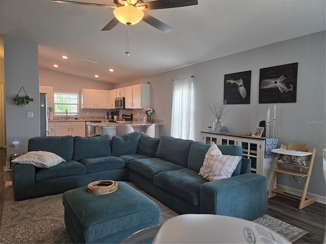 3003 58th Way E, Palmetto, FL 34221 - living room with dark wood finished floors, vaulted ceiling, ceiling fan, recessed lighting, and baseboards