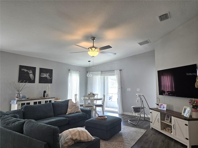 3003 58th Way E, Palmetto, FL 34221 - living area featuring ceiling fan, dark wood-type flooring, a textured ceiling, and baseboards