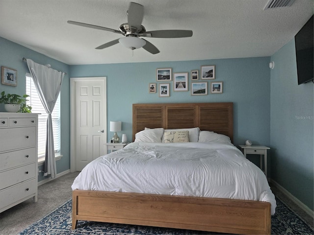 3003 58th Way E, Palmetto, FL 34221 - bedroom with baseboards, carpet flooring, a textured ceiling, and a ceiling fan