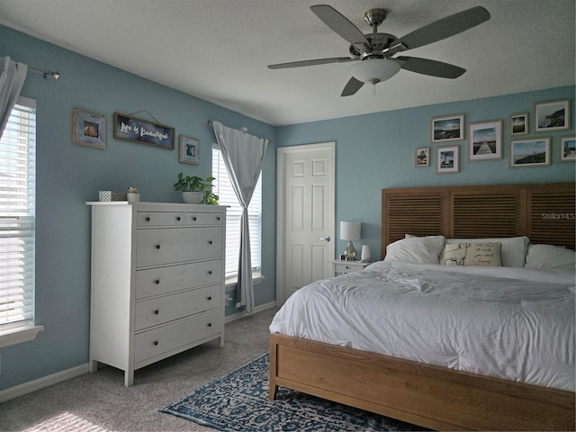3003 58th Way E, Palmetto, FL 34221 - bedroom featuring multiple windows, carpet floors, baseboards, and ceiling fan