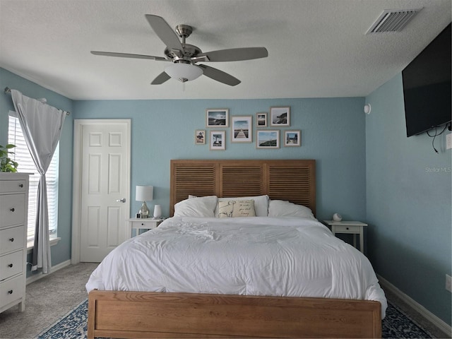 3003 58th Way E, Palmetto, FL 34221 - bedroom with carpet flooring, baseboards, a ceiling fan, and a textured ceiling
