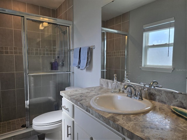 3003 58th Way E, Palmetto, FL 34221 - full bath featuring a stall shower, vanity, and toilet