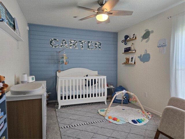 3003 58th Way E, Palmetto, FL 34221 - carpeted bedroom featuring ceiling fan, a crib, and baseboards