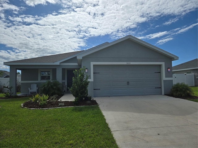 3003 58th Way E, Palmetto, FL 34221 - single story home with driveway, stucco siding, and an attached garage
