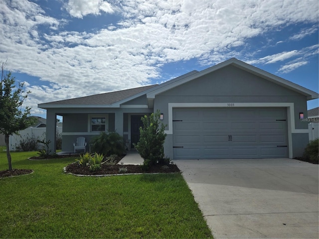 3003 58th Way E, Palmetto, FL 34221 - ranch-style house with a garage, driveway, a front yard, and stucco siding
