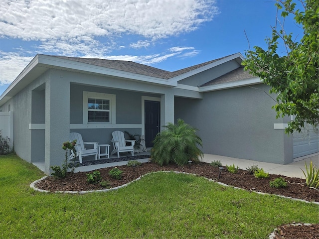 3003 58th Way E, Palmetto, FL 34221 - ranch-style home with covered porch, stucco siding, a front yard, and roof with shingles