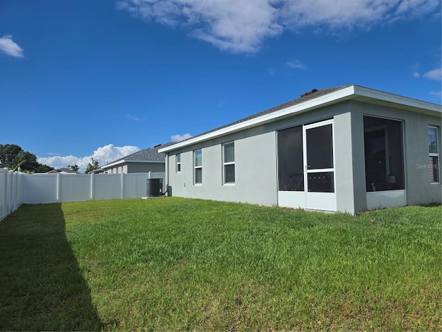 3003 58th Way E, Palmetto, FL 34221 - rear view of house with stucco siding and central air condition unit