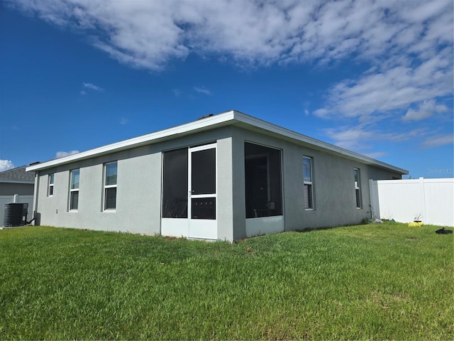 3003 58th Way E, Palmetto, FL 34221 - view of property exterior with stucco siding, central AC, and a sunroom