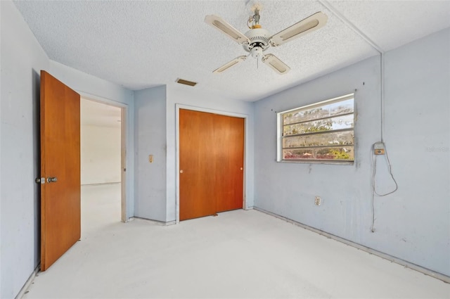 unfurnished bedroom featuring a closet, ceiling fan, and a textured ceiling