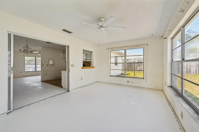 unfurnished sunroom with a chandelier